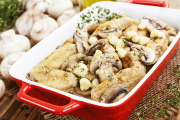 Chicken wings baked with mushrooms