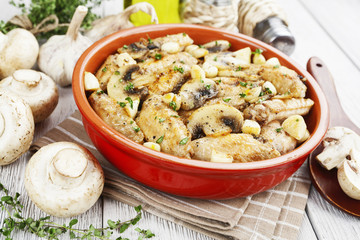 Chicken wings baked with mushrooms