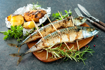 Grilled mackerel fish with baked potatoes