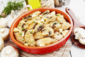 Chicken wings baked with mushrooms