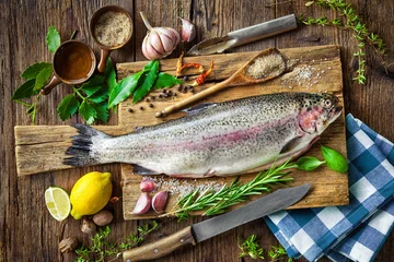 Fotobehang Fresh trout with spices and seasoning © Alexander Raths