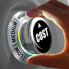 How much does it cost? Hand adjusting a Low to high cost button. Concept picture.