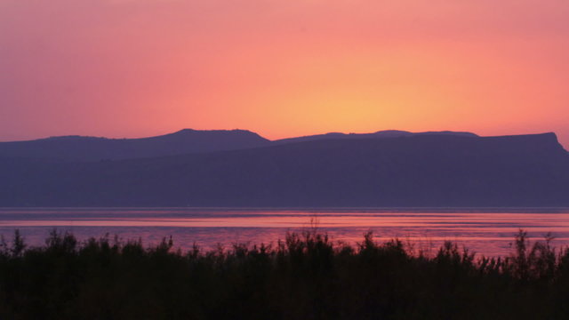Royalty Free Stock Video Footage of the Sea of Galilee at sunset shot in Israel at 4k with Red.