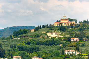 Fototapeta premium Aerial view over Shrine of Our Lady or Sanctuary of Madonna of Lourdes in cloudy summer day, Verona, Italy