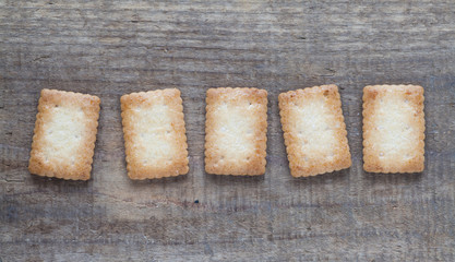 Piece of Mini coconut biscuit on wood table background