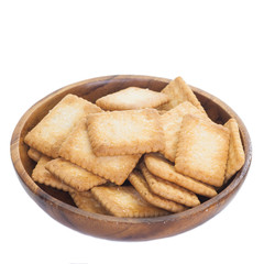 Mini coconut biscuit in wood plate isolated on white background