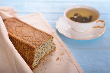 cake with poppy seeds and a cup of tea