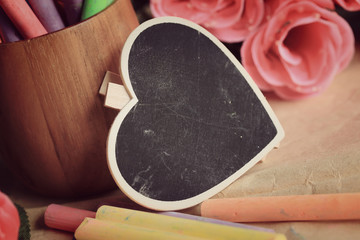 Colorful chalk with black heart