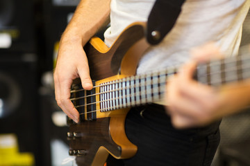 Fototapeta na wymiar close up of musician with guitar at music studio