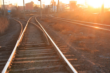 Fototapeta na wymiar Railroad tracks at sunset
