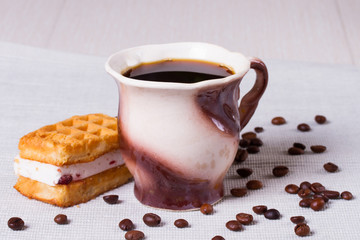 Cup of coffee, waffles and coffee beans