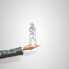 Caricatures of businessman in palm