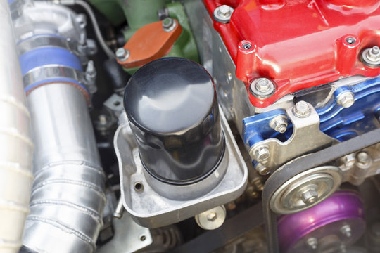 Oil filter on diesel racing car engine.