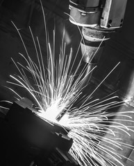 Welding robots movement in a car factory back white