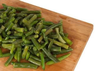 Green string beans on a wooden board