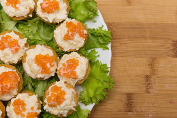 tartlets with red caviar and cheese appetizer