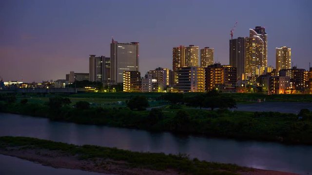 Kawasaki, Japan skyline at the Tamagawa River.