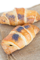 Fresh and tasty croissant over white background