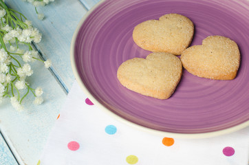 Heart-shaped butter cookies with sugar.