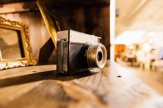 vintage photo camera on shelf warm toning