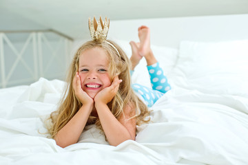 Little happy princess are playing in the bed  © nuzza11