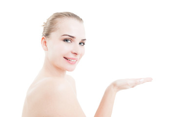 Beautiful skin care model holding white copy space