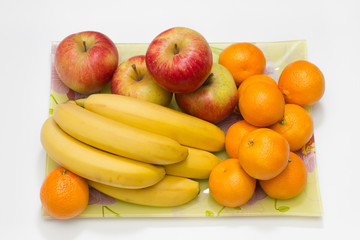 composition of apple banana and mandarin fruits on plate