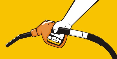 Hand holding fuel pump nozzle