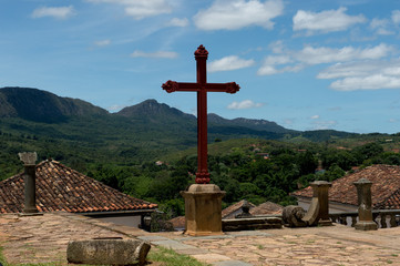 Fototapeta na wymiar Tiradentes, BRAZIL - january 08, 2016: Colonial houses and the hills of St. Joseph in the background (Unesco World Heritage)