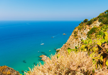 Small boats on the crystal clear mediterranean sea, Calabria, Italy