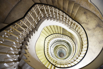 Spiral staircase in the interior of a tall building
