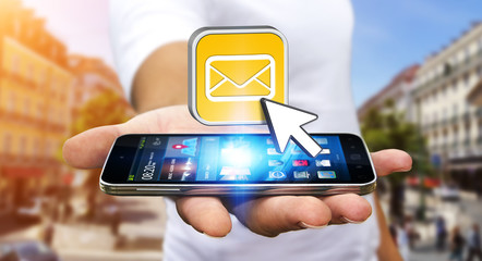 Young man using modern mobile phone to send message