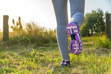 Woman running in a field