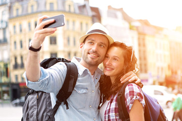 Young couple on holidays taking selfie