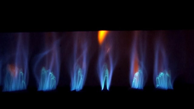 Furnace burners ignite in slow motion.