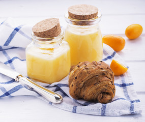 Fresh croissants for breakfast Kurd with lemon and fresh kumquats