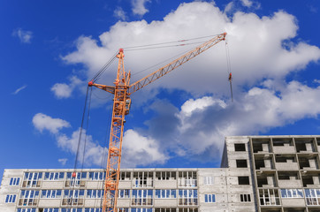 Building of houses and big cranes