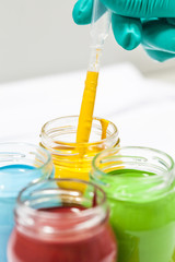 Colorful paints in jars