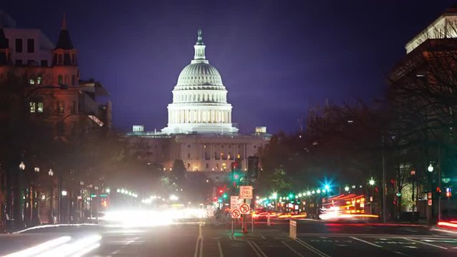 Time lapse of the US Captiol at night with flares.
