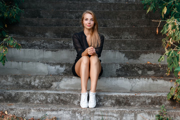 Portrait of a girl sitting on the stairs