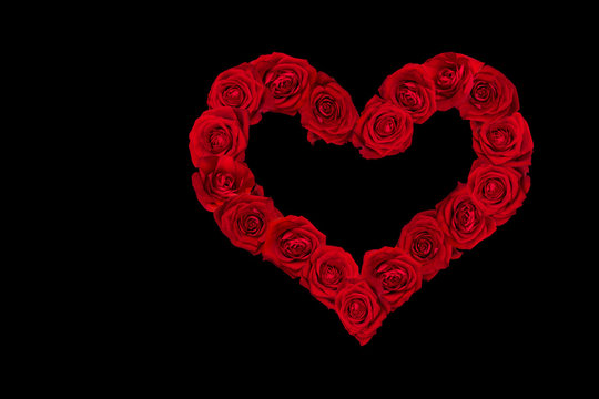 Valentines Day Heart made of Red Roses.  Black Background.