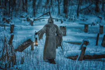 Figure man from back with  scythe of death.