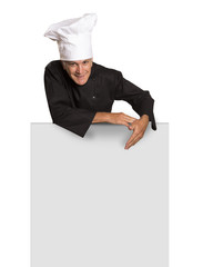 Mature man chef in uniform thumbs up and showing blank visiting