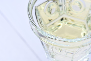 Glass of white wine on wooden board