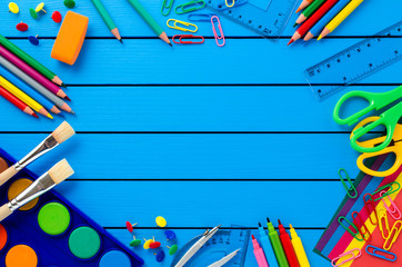 School supplies on blue wooden table