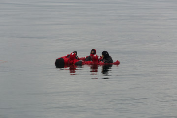 Swimming in an immersion suit