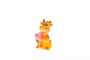 Statuette of wax cow with heart Valentine's Day