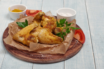 fried chicken wings in a spicy curry sauce