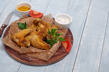 fried chicken wings in a spicy curry sauce