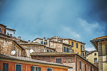 Fototapeta na wymiar antique roofs in Siena